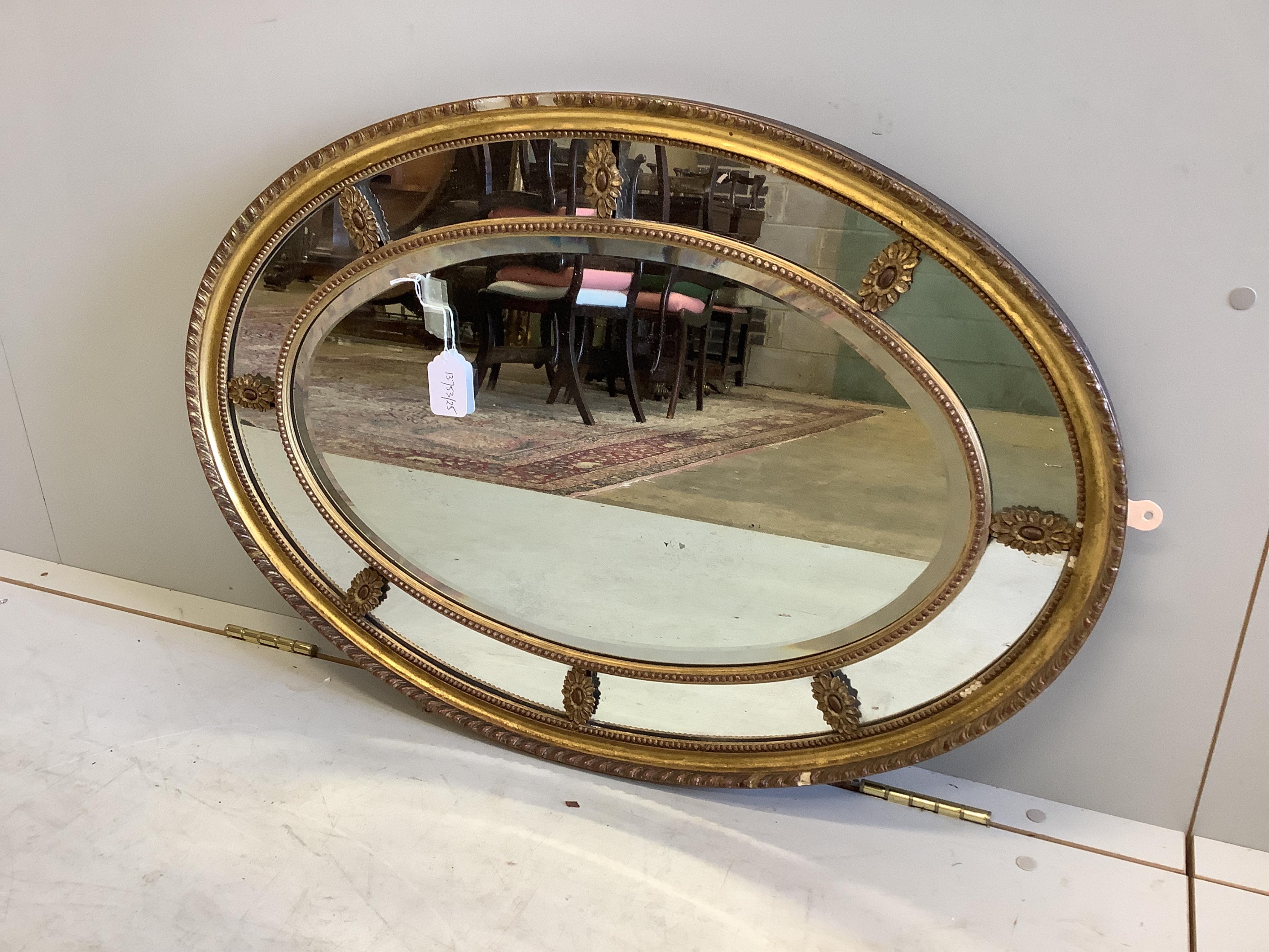 A Victorian Adam style oval giltwood and composition wall mirror with marginal plate, width 81cm, height 57cm